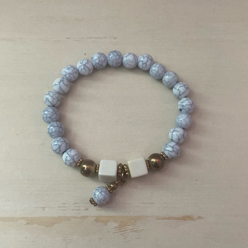 marble with gold bracelet